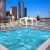 a pool with a city in the background