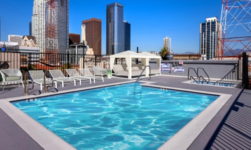 a pool with a city in the background