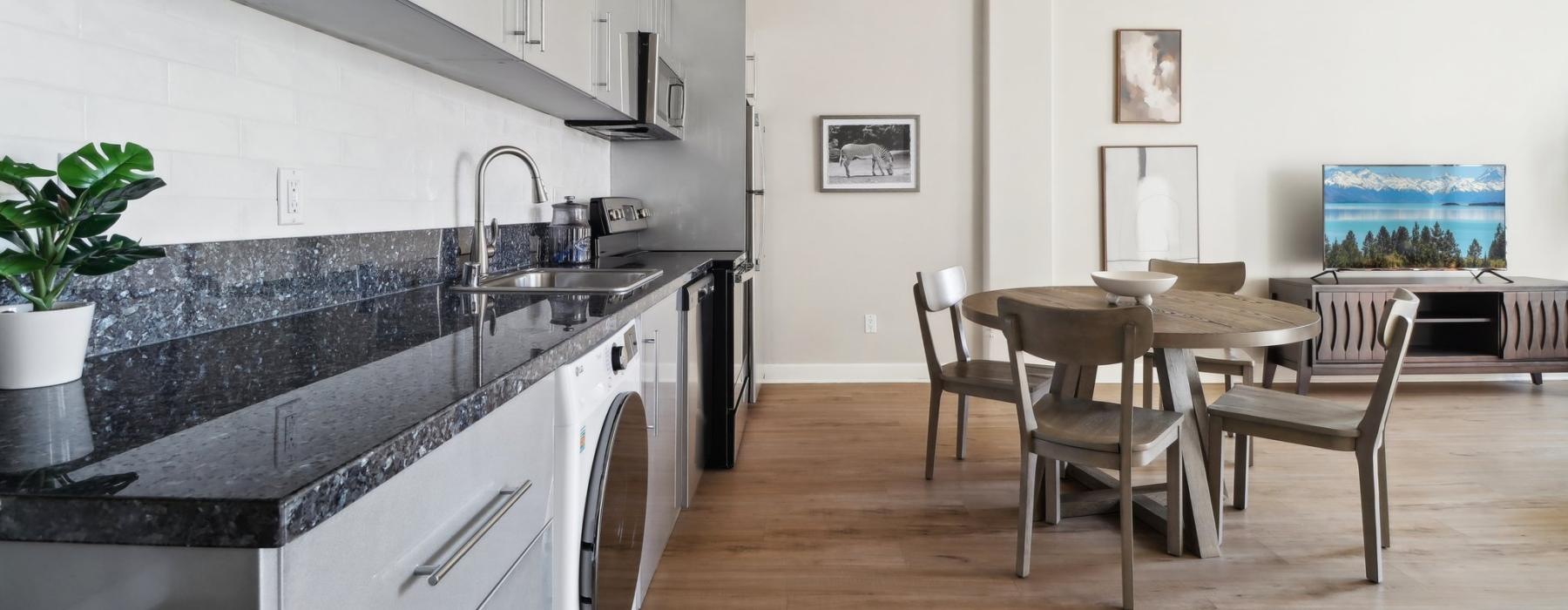a kitchen with a table and chairs
