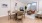 a living room with a table and chairs