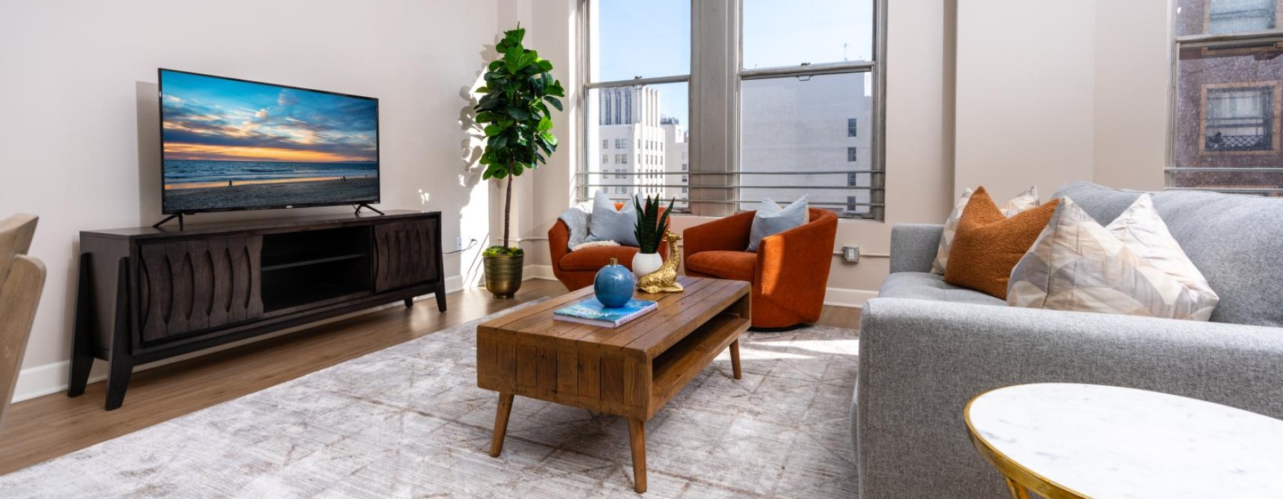 a living room with a tv and couches