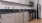 a kitchen with gray cabinets