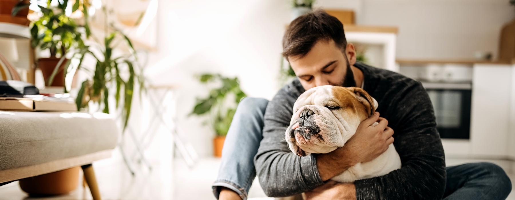 a person holding a dog