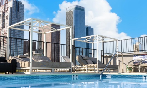 a swimming pool with a building in the background