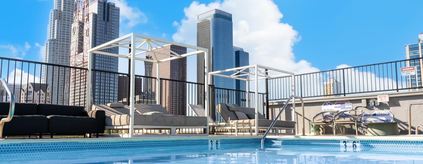 a swimming pool with a building in the background