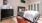 a bedroom with a bed and dresser
