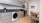 a kitchen with gray cabinets